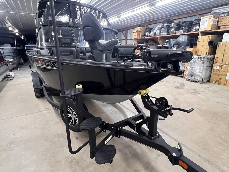 Slide: The Image of 2023 Tracker TARGA V-19 WT TE boat on trailer in storage facility. - 11