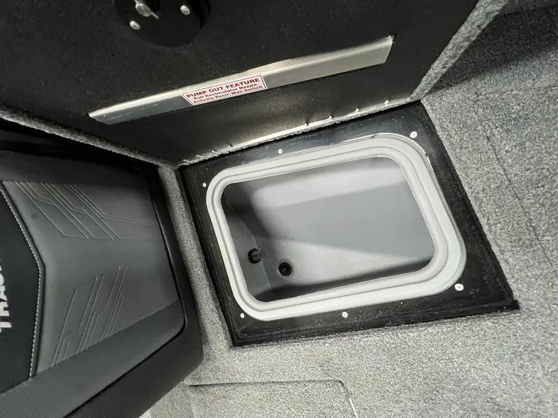 Slide: The Image of 2023 Tracker TARGA V-19 WT TE boat storage compartment with pump-out feature. - 13
