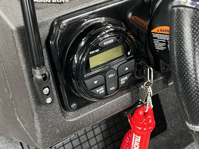 Slide: The Image of Control panel of 2023 Tracker TARGA V-19 WT TE boat with key and warning label. - 17