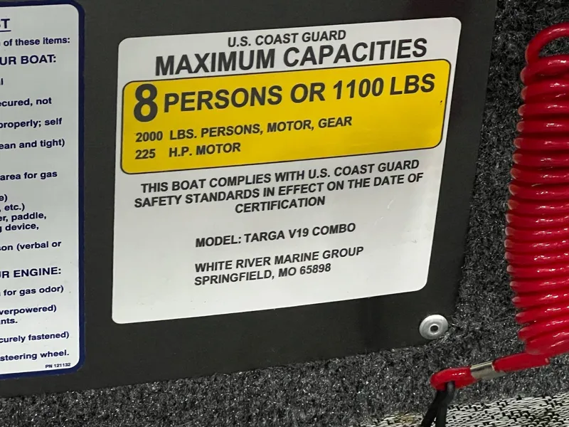 Slide: The Image of 2023 Tracker TARGA V-19 WT TE boat capacity label, 8 persons or 1100 lbs, USCG compliant. - 18