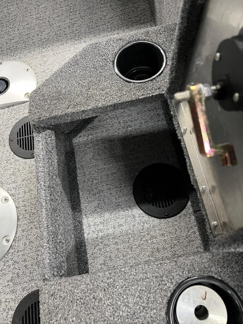 Slide: The Image of Interior of 2023 Tracker TARGA V-19 WT TE boat with cup holders and storage compartments. - 22