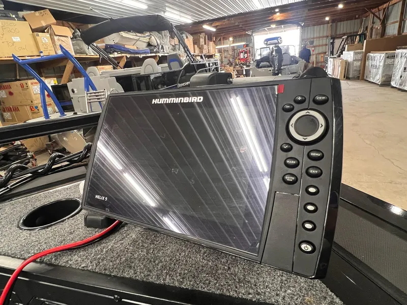 Slide: The Image of 2023 Tracker TARGA V-19 WT TE with Humminbird Helix 9 fish finder in a warehouse setting. - 25