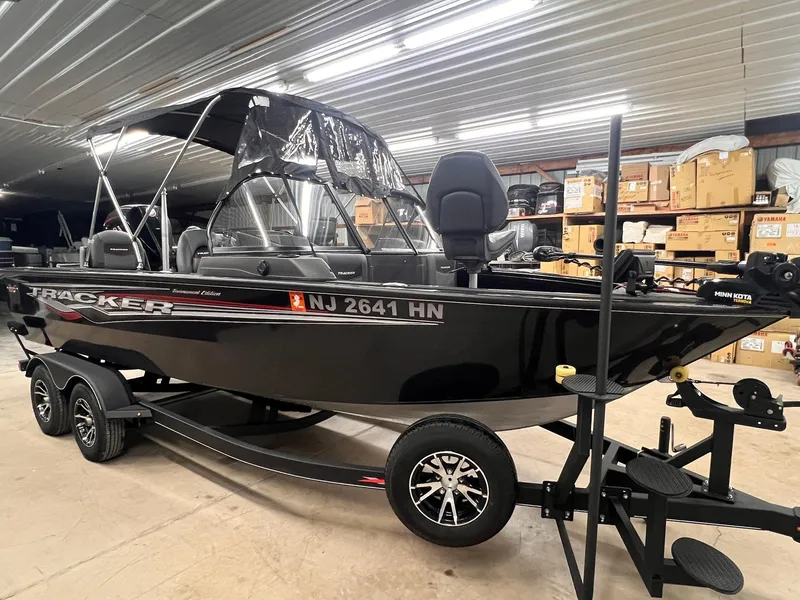 Slide: The Image of 2023 Tracker TARGA V-19 WT TE boat in a warehouse, on a trailer. - 27