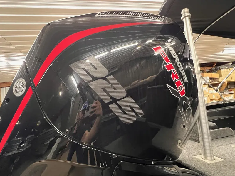 Slide: The Image of Mercury Pro XS 225 engine on 2023 Tracker TARGA V-19 WT TE boat in a garage. - 31
