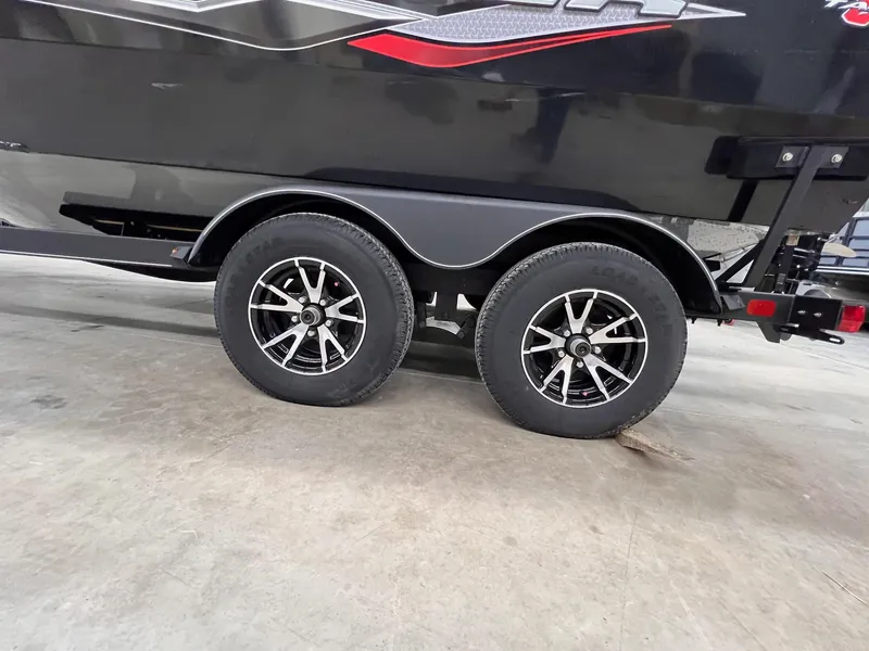 Slide: The Image of 2023 Tracker TARGA V-19 WT TE trailer with dual wheels on concrete floor. - 38
