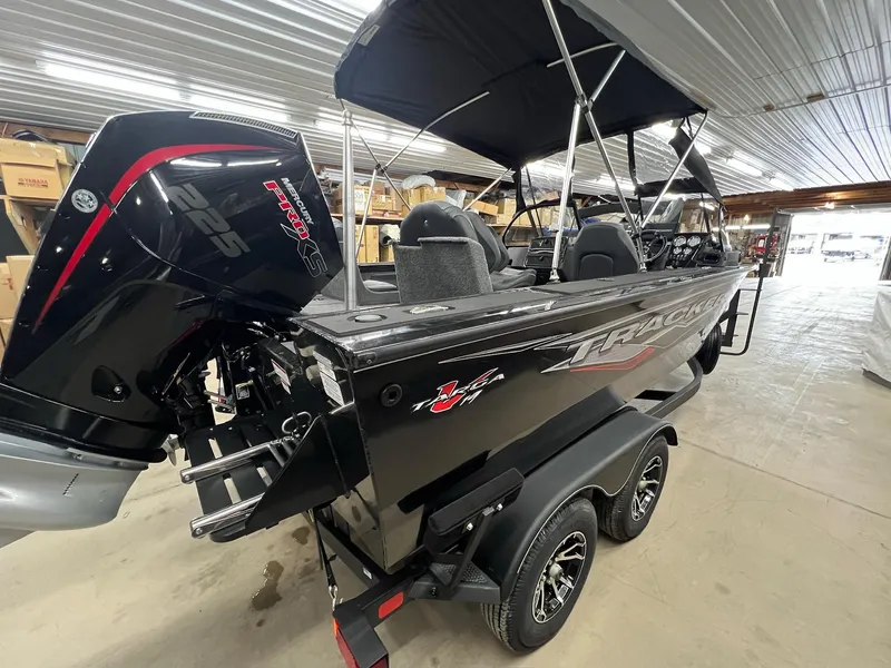 Slide: The Image of 2023 Tracker TARGA V-19 WT TE boat with Mercury 225 Pro XS engine in a showroom. - 4