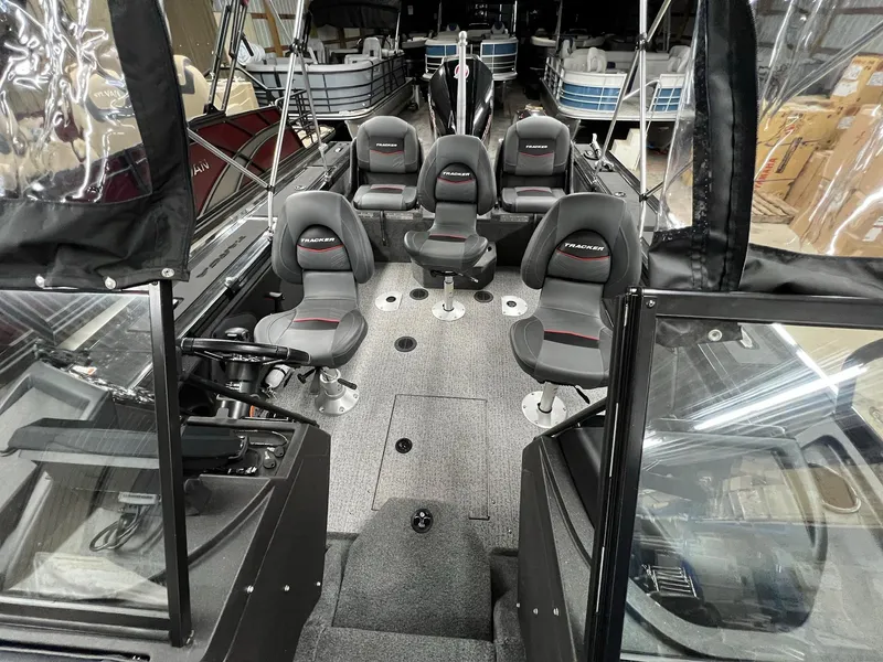 Slide: The Image of 2023 Tracker TARGA V-19 WT TE boat interior with multiple seats and modern design. - 40