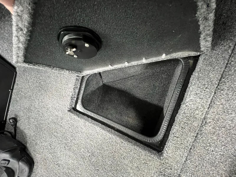 Slide: The Image of 2023 Tracker TARGA V-19 WT TE boat storage compartment with carpeted interior. - 41