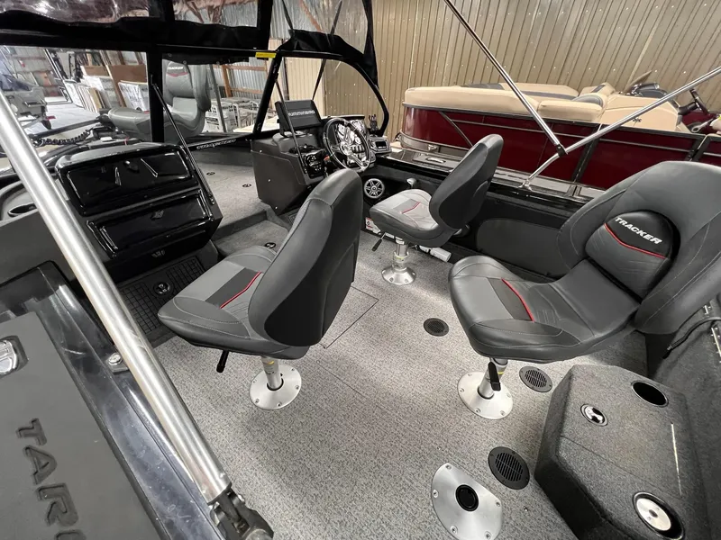 Slide: The Image of 2023 Tracker TARGA V-19 WT TE boat interior with modern seating and steering console. - 42