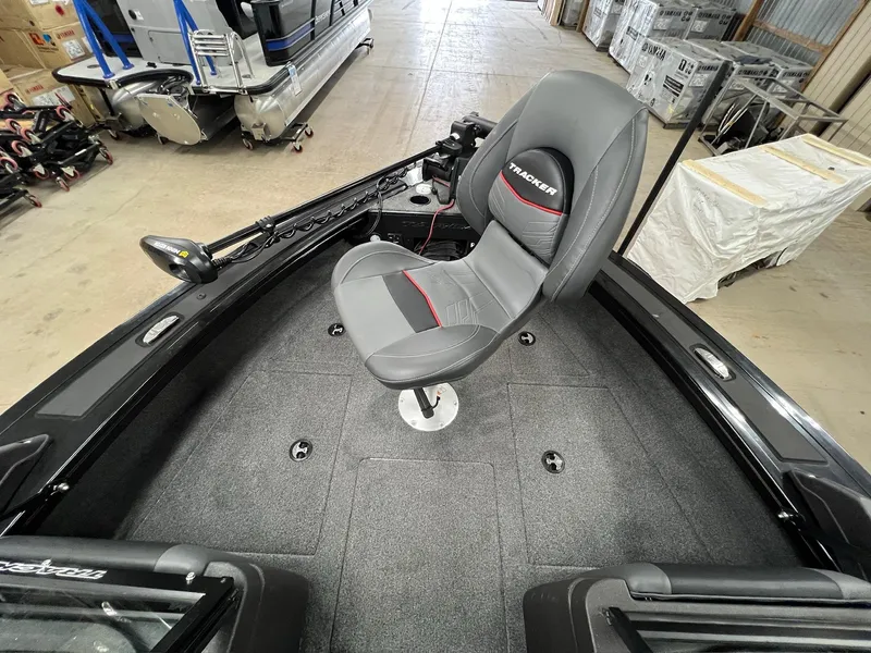 Slide: The Image of 2023 Tracker TARGA V-19 WT TE boat interior with gray seat and fishing equipment. - 5