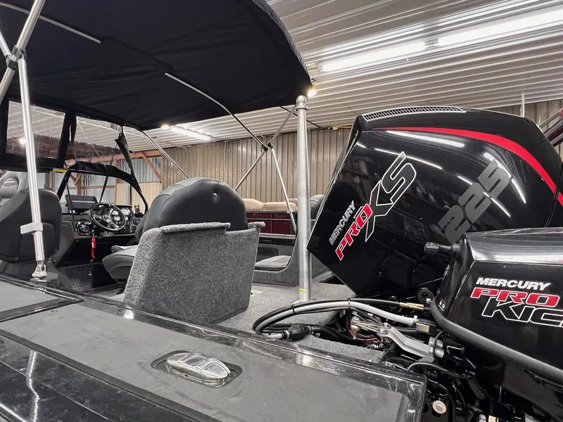 Slide: The Image of 2023 Tracker TARGA V-19 WT TE boat with Mercury Pro XS engine in a garage. - 9