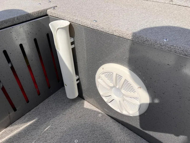 Slide: The Image of 2016 Crestliner 1650 Discovery Side Console interior with speaker and rod holder. - 22