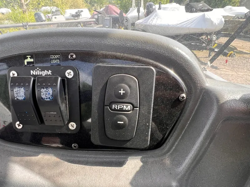 Slide: The Image of Control panel of 2016 Crestliner 1650 Discovery Side Console with cockpit light switches. - 7