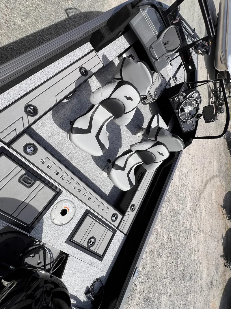Slide: The Image of 2025 Starcraft Storm 176 DC Pro SE boat interior with modern seating and dashboard. - 31