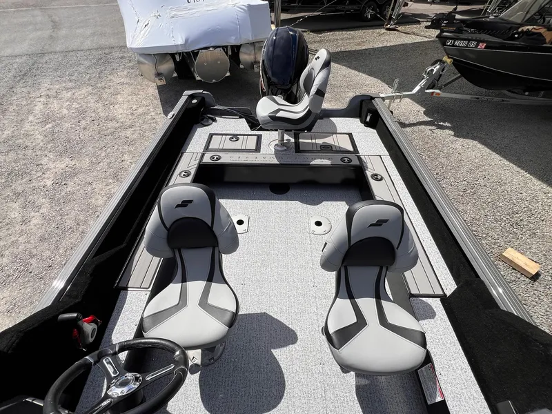 Slide: The Image of 2025 Starcraft Storm 176 DC Pro SE boat interior with modern seating and steering wheel. - 32