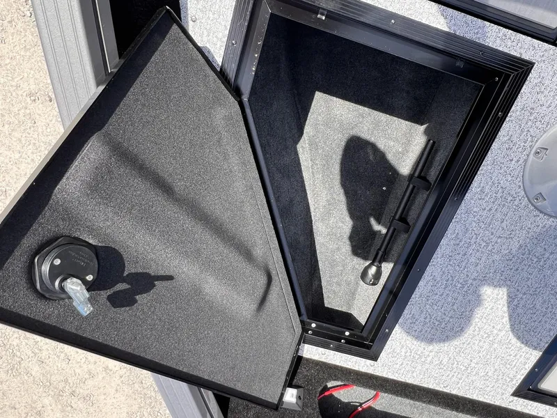 Slide: The Image of Open storage compartment of 2025 Starcraft Storm 176 DC Pro SE boat. - 39
