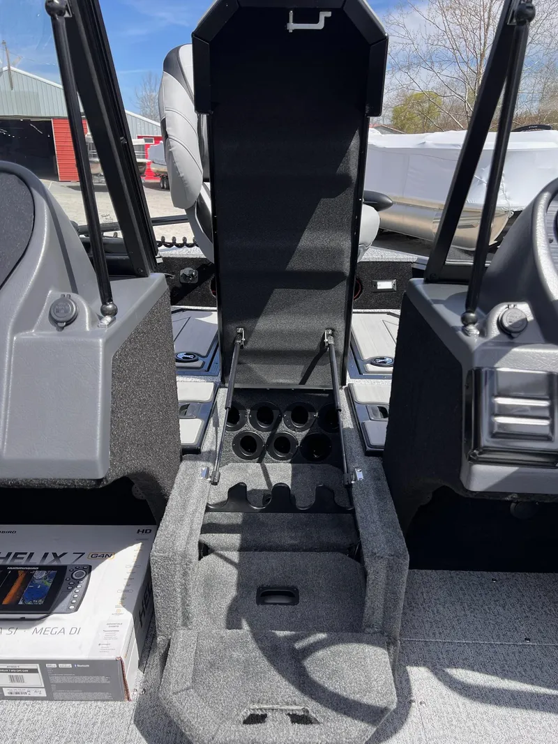 Slide: The Image of 2025 Starcraft Storm 176 DC Pro SE boat interior with storage compartments and seating. - 44