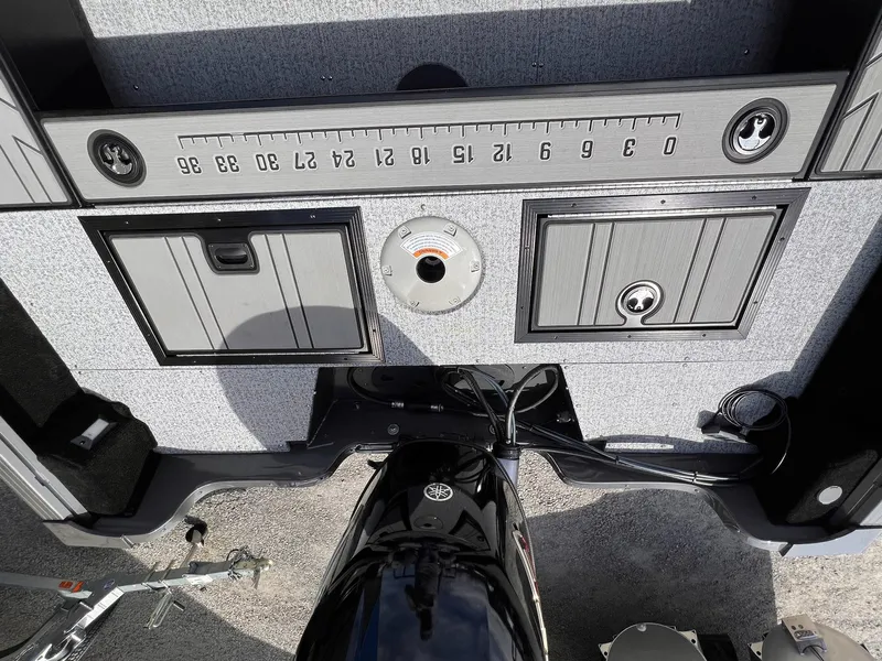 Slide: The Image of 2025 Starcraft Storm 176 DC Pro SE boat interior with storage compartments and measurement scale. - 9