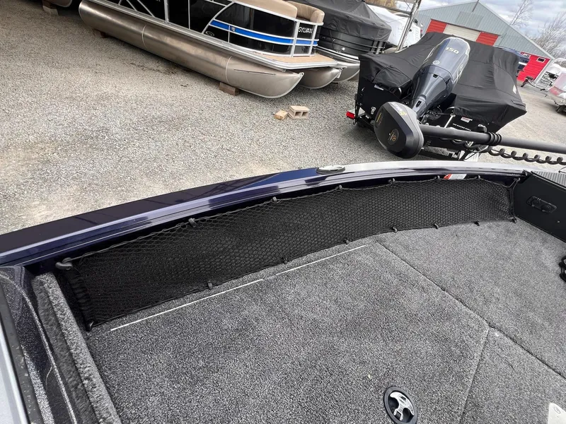 Slide: The Image of 2020 Ranger VS1782 WT boat interior with carpeted deck and storage netting. - 20