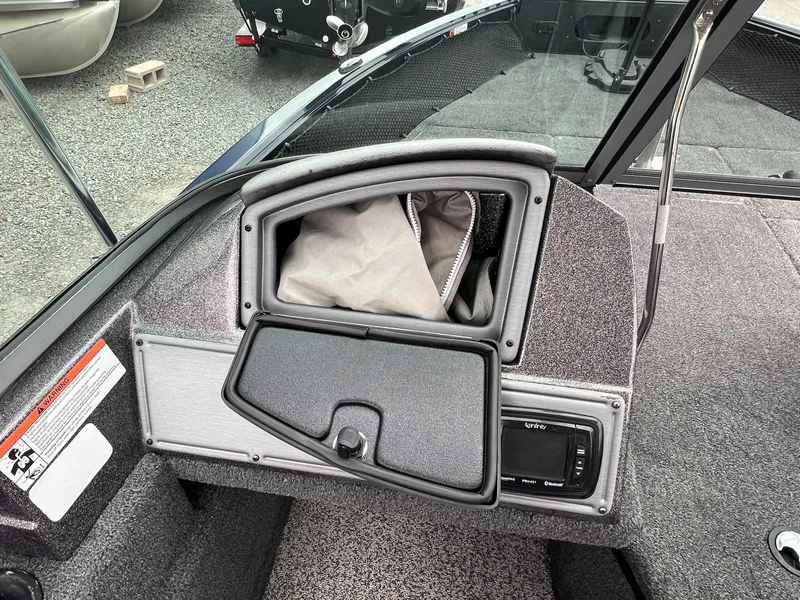 Slide: The Image of 2020 Ranger VS1782 WT boat interior with storage compartment and audio system. - 22