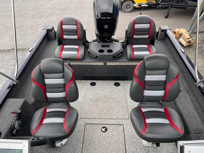 Slide: The Image of 2020 Ranger VS1782 WT boat interior with four gray and red seats, motor, and storage compartments. - 28