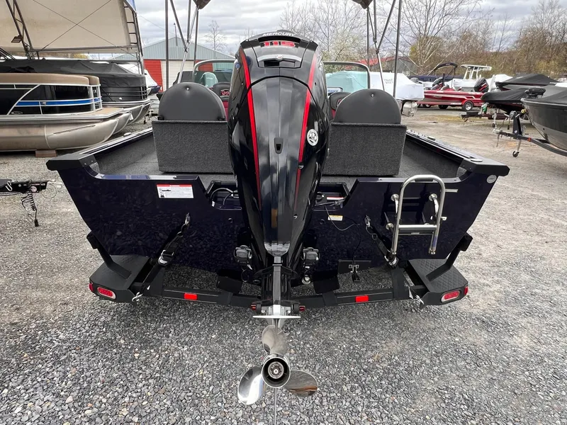 Slide: The Image of 2020 Ranger VS1782 WT boat with outboard motor, parked on gravel lot. - 3