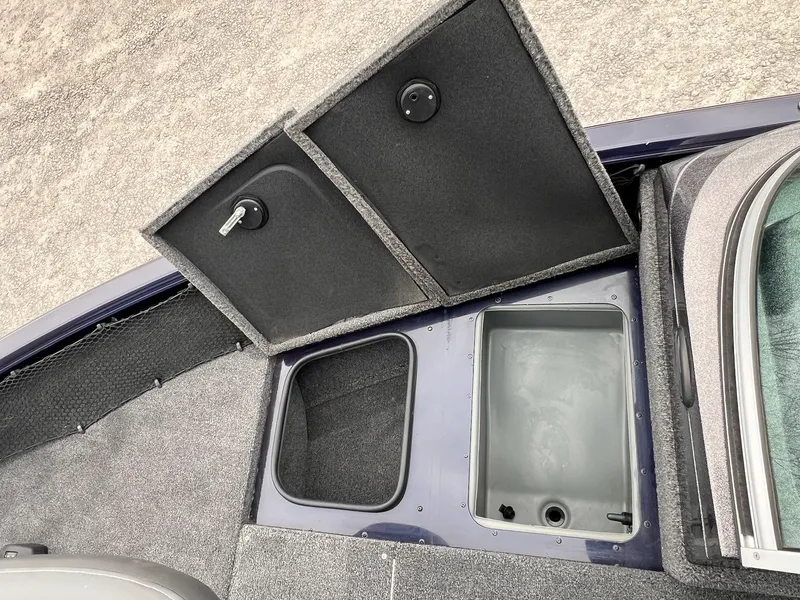 Slide: The Image of 2020 Ranger VS1782 WT boat storage compartments with open lids, showcasing interior space. - 34