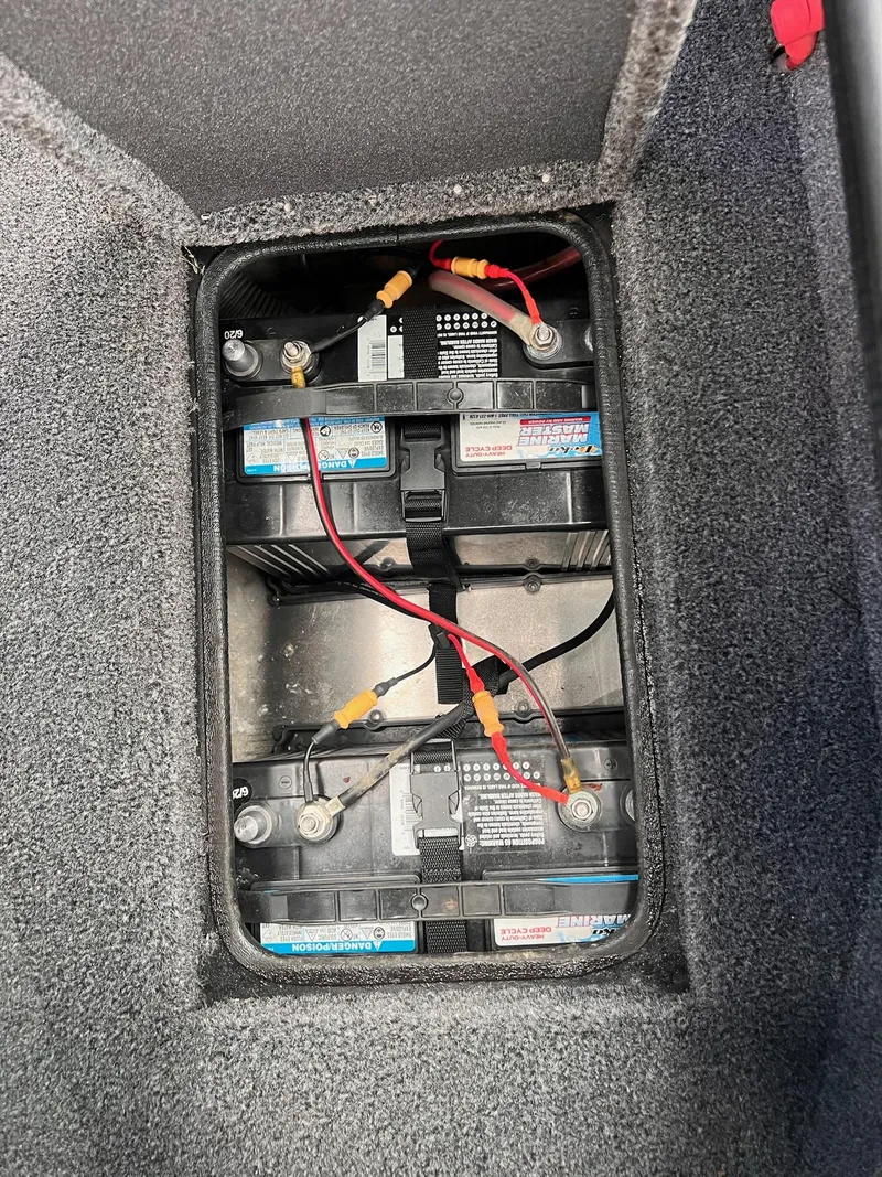 Slide: The Image of 2020 Ranger VS1782 WT boat battery compartment with dual batteries and wiring. - 4