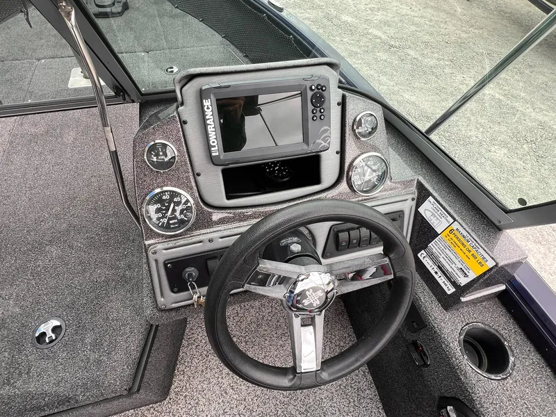 Slide: The Image of 2020 Ranger VS1782 WT boat dashboard with steering wheel and Lowrance display. - 41