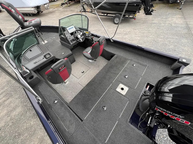 Slide: The Image of 2020 Ranger VS1782 WT boat interior with seating, steering console, and Mercury Pro motor. - 43