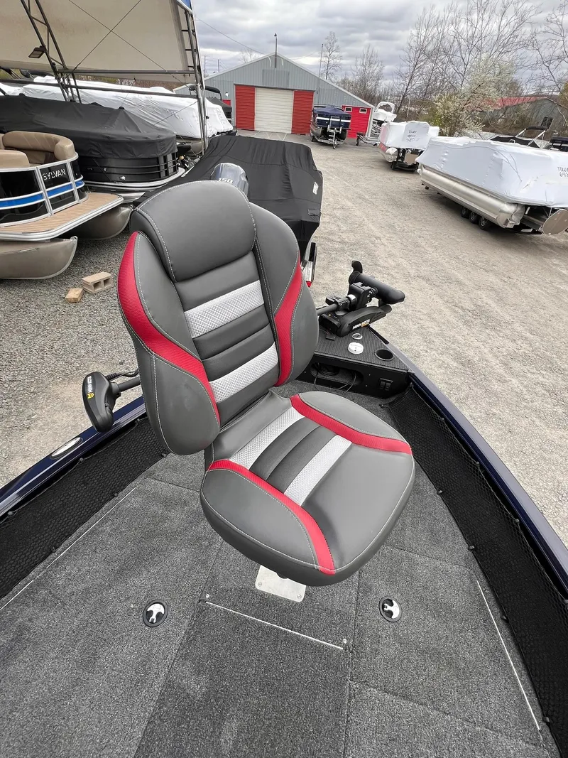 Slide: The Image of 2020 Ranger VS1782 WT boat seat with red and gray accents in a showroom. - 6