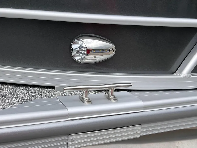 Slide: The Image of 2025 Berkshire LE Series 24UL LE boat detail with cleat and light fixture. - 10