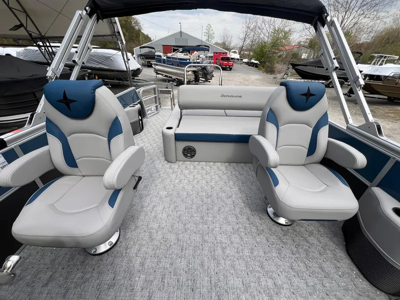 Slide: The Image of 2025 Berkshire LE Series 24UL LE pontoon boat interior with plush seating and modern design. - 11