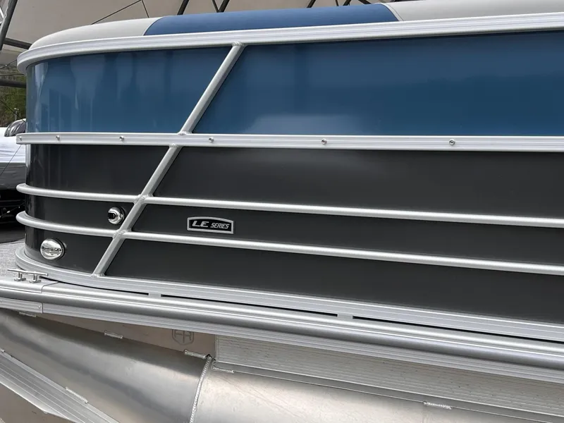 Slide: The Image of 2025 Berkshire LE Series 24UL pontoon boat, blue and gray exterior detail. - 12