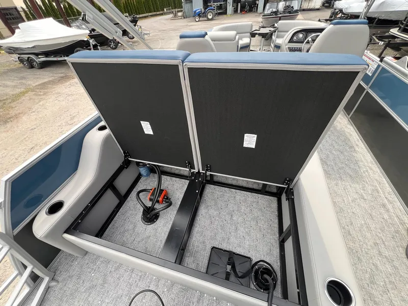 Slide: The Image of 2025 Berkshire LE Series 24UL LE pontoon boat interior with open storage compartment. - 21