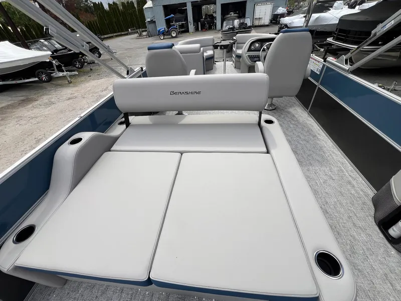 Slide: The Image of 2025 Berkshire LE Series 24UL LE pontoon boat with spacious seating and cup holders. - 5