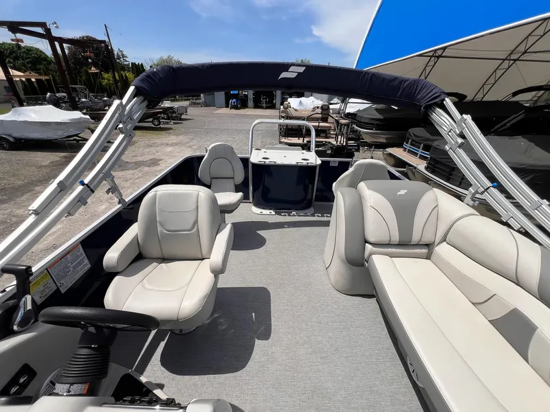 Slide: The Image of 2021 Starcraft EX Fish EX 22 FD pontoon boat interior with seating and canopy. - 12