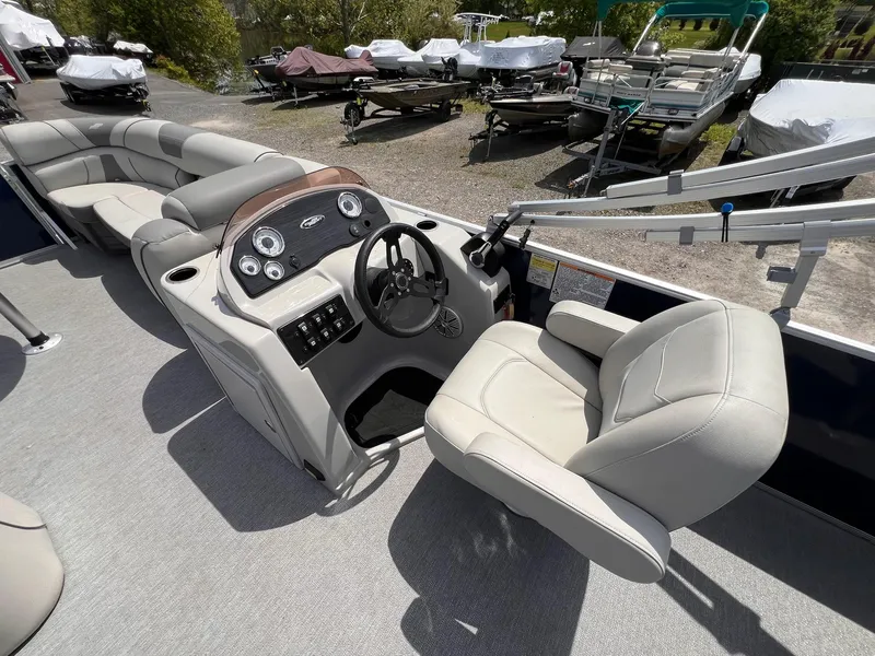 Slide: The Image of 2021 Starcraft EX Fish EX 22 FD boat interior with steering console and seating. - 15