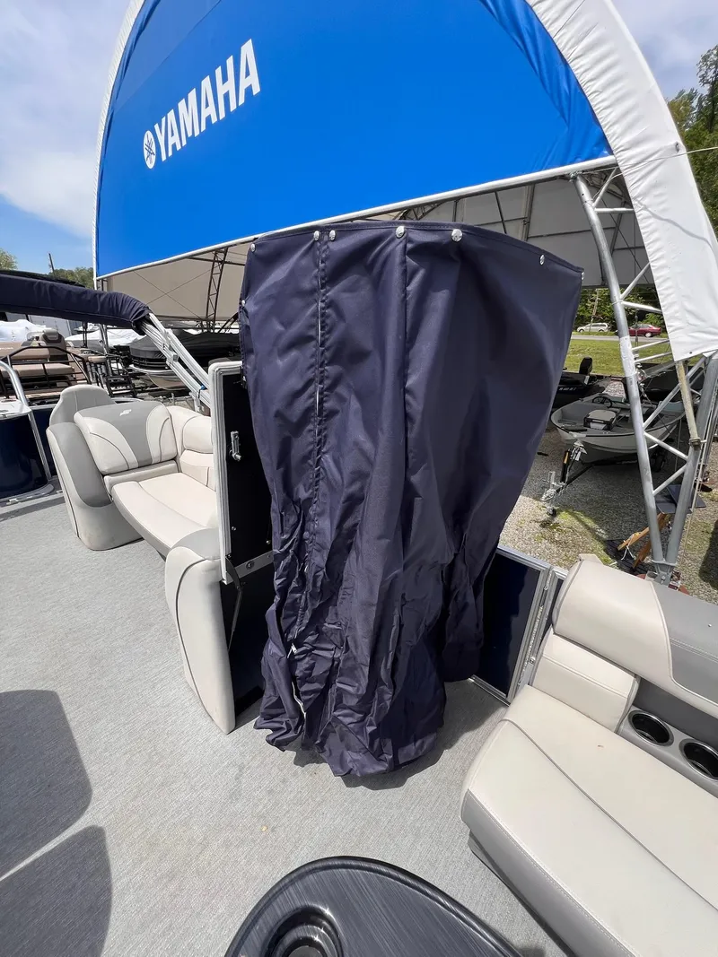 Slide: The Image of 2021 Starcraft EX Fish EX 22 FD boat interior with seating and privacy curtain. - 16