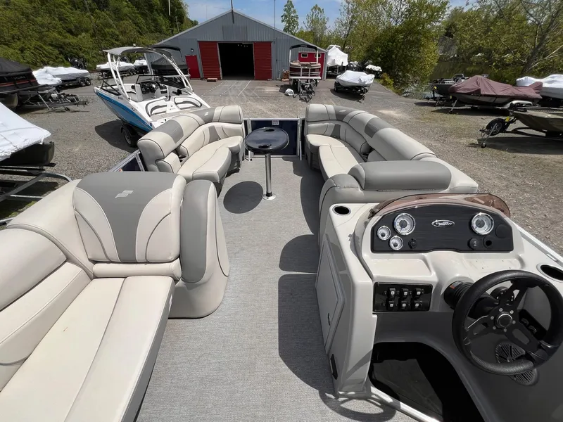 Slide: The Image of 2021 Starcraft EX Fish EX 22 FD pontoon boat with spacious seating and modern dashboard. - 18