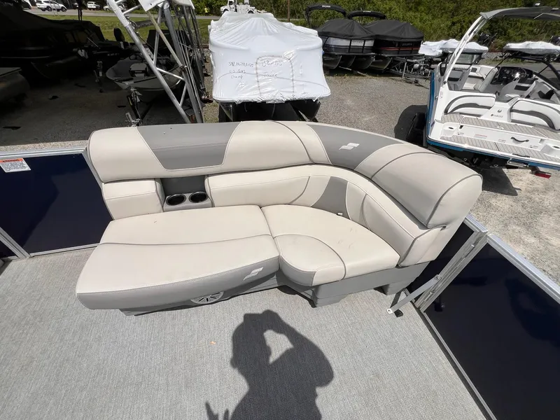 Slide: The Image of 2021 Starcraft EX Fish EX 22 FD boat seating area with cup holders, outdoor display. - 20