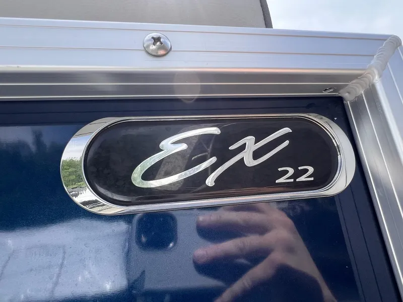 Slide: The Image of 2021 Starcraft EX Fish EX 22 FD emblem on blue background. - 24