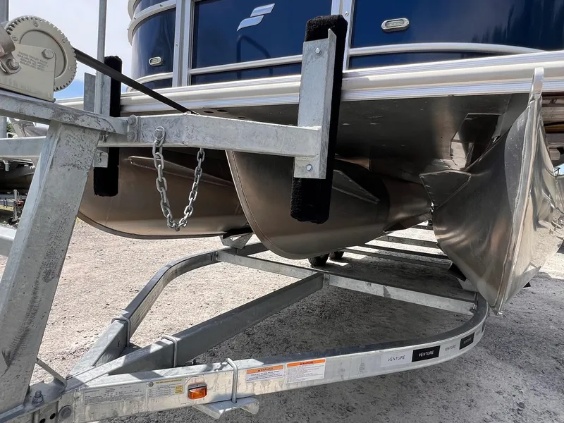 Slide: The Image of 2021 Starcraft EX Fish EX 22 FD pontoon boat on trailer, close-up view. - 27