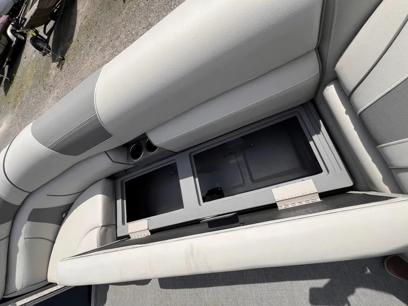 Slide: The Image of 2021 Starcraft EX Fish EX 22 FD boat seat with storage compartment open. - 5