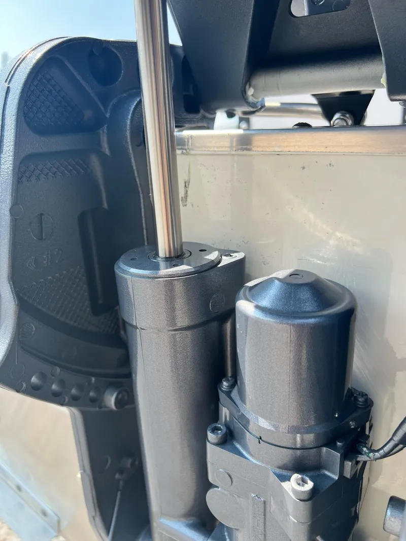 Slide: The Image of Close-up of 2024 Starcraft Patriot 16 SC boat motor components. - 15