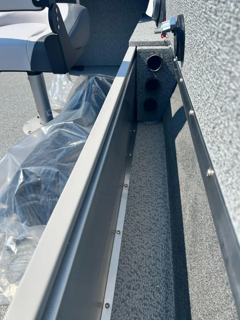 Slide: The Image of 2024 Starcraft Patriot 16 SC interior detail with seating and storage compartments. - 16