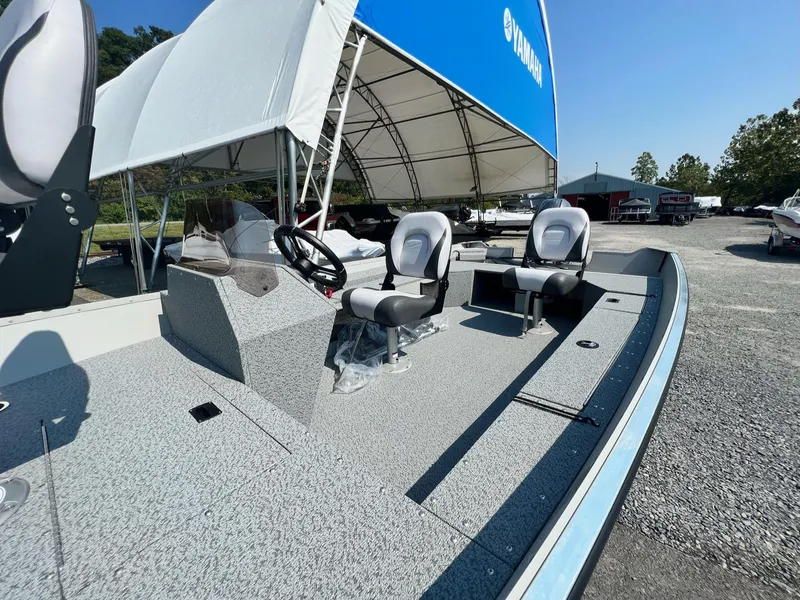 Slide: The Image of 2024 Starcraft Patriot 16 SC boat with dual seats and steering console. - 9