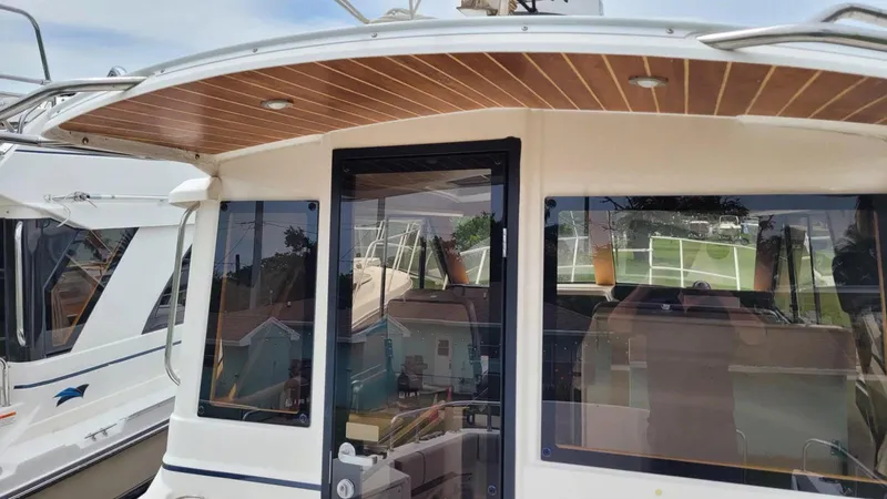 Slide: The Image of 2021 Cutwater C-28 boat with sleek design and wooden ceiling detail. - 11