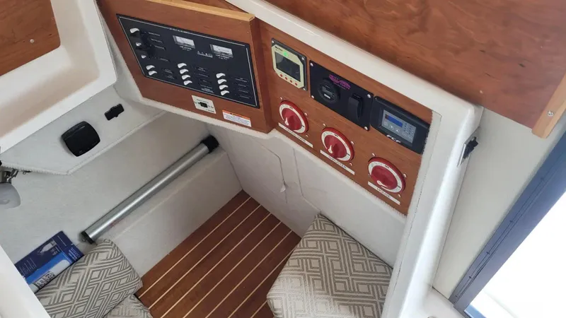 Slide: The Image of 2021 Cutwater C-28 boat interior with control panel and seating area. - 18