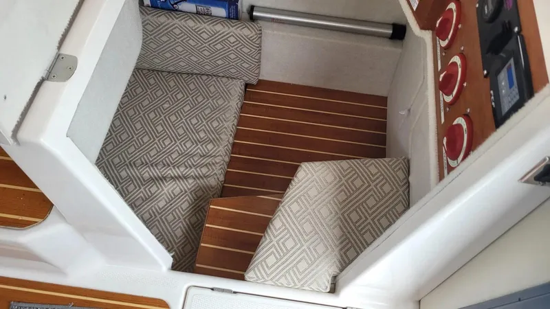 Slide: The Image of 2021 Cutwater C-28 interior with patterned cushions and wood flooring. - 19